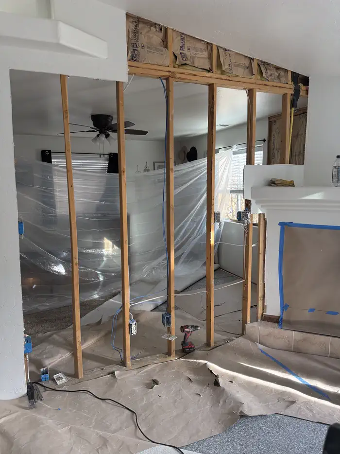 Wall opened up, dust containment in place